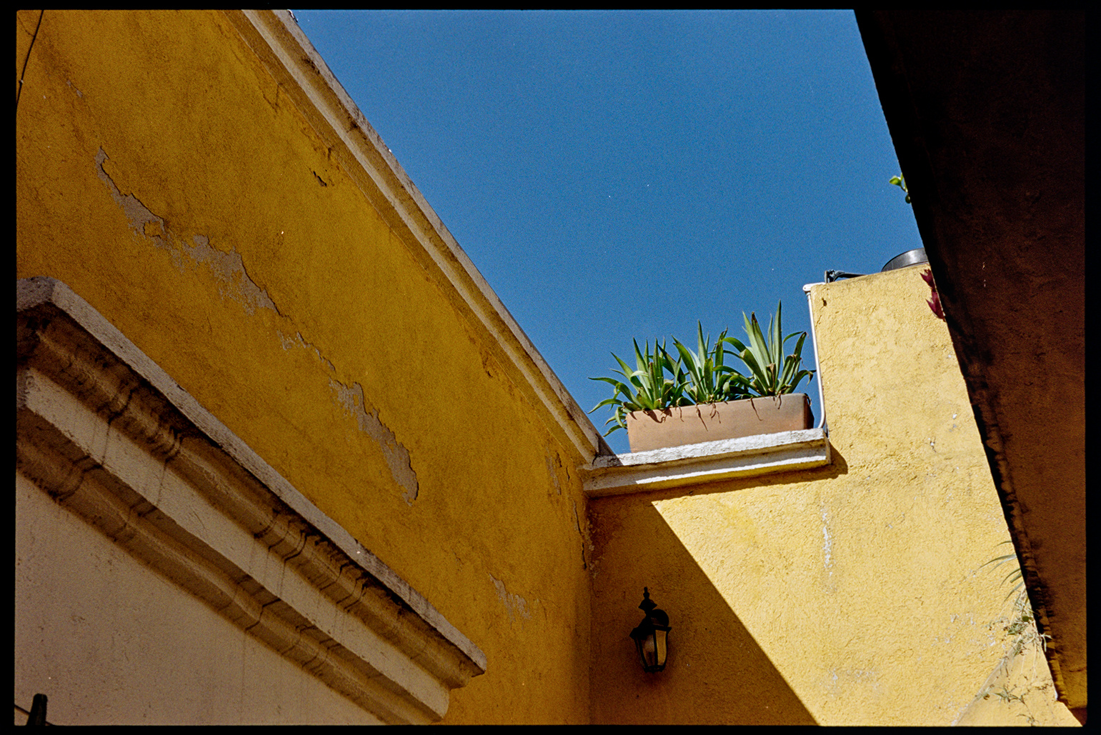 View of the sky from inside the corridor of a cafe in Oaxaca