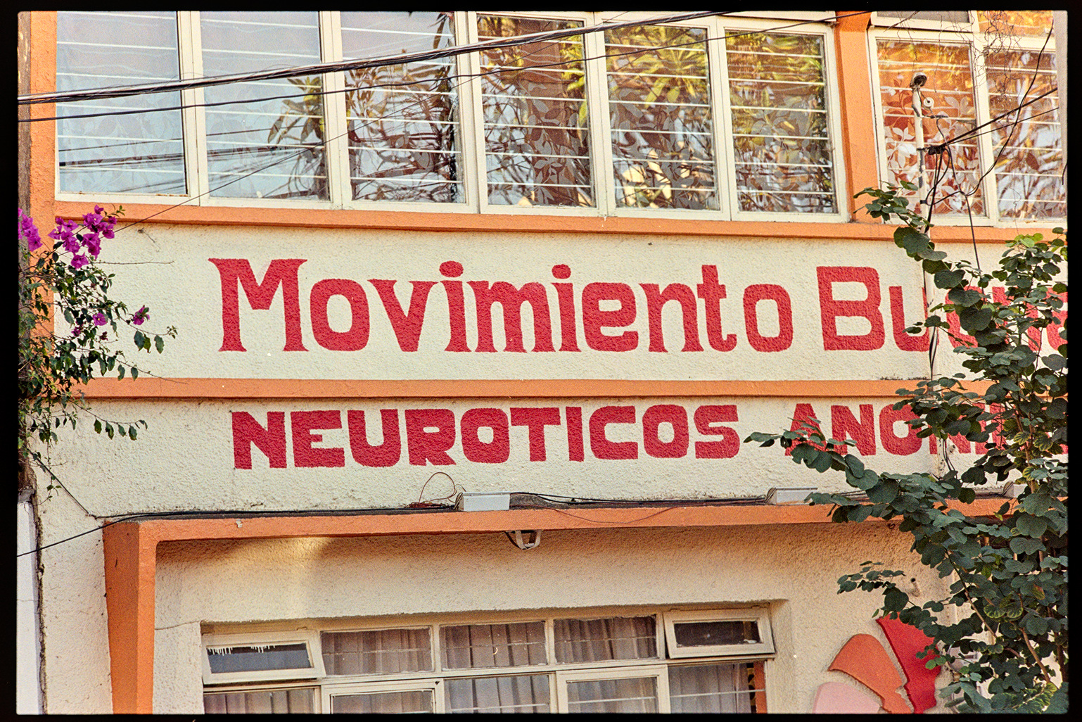 Front of a building with cream and orange colored paint in Oaxaca City