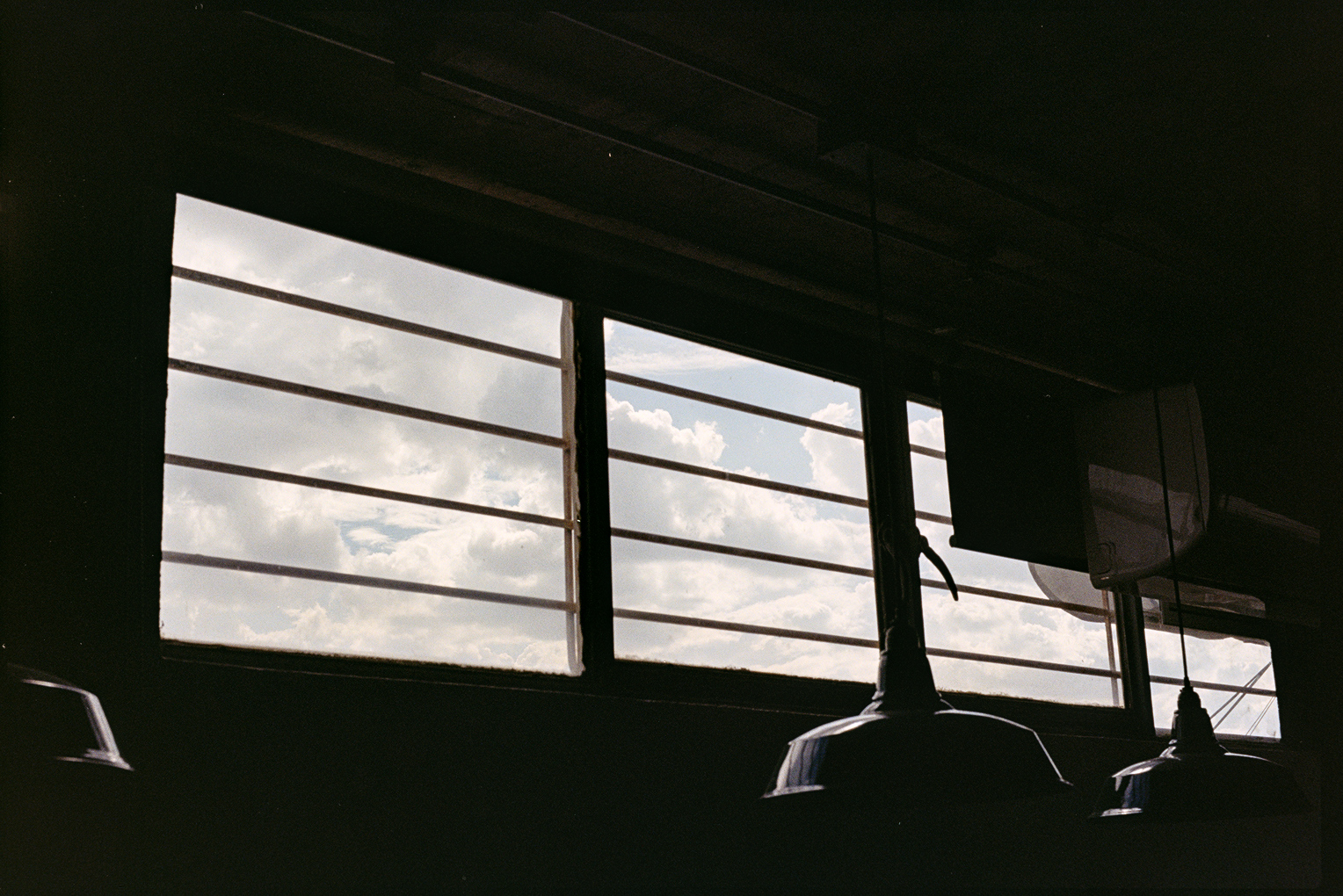 Clouds in sky seen through window of apartment in Oaxaca City