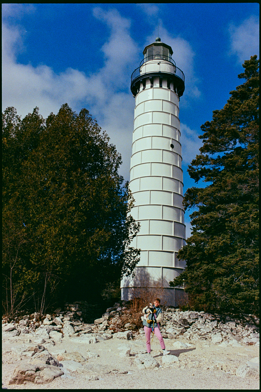 Kallie and Annie in front of a lighthouse on Cana Island in Door County, Wisconsin