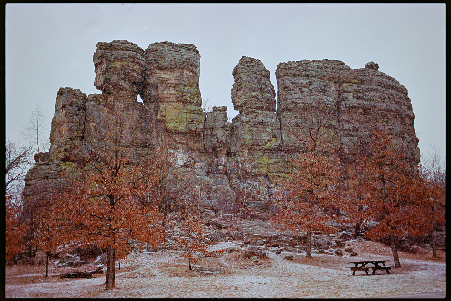 Large rock outcropping in teh snow at a rest stop on the highway in Wisconsin