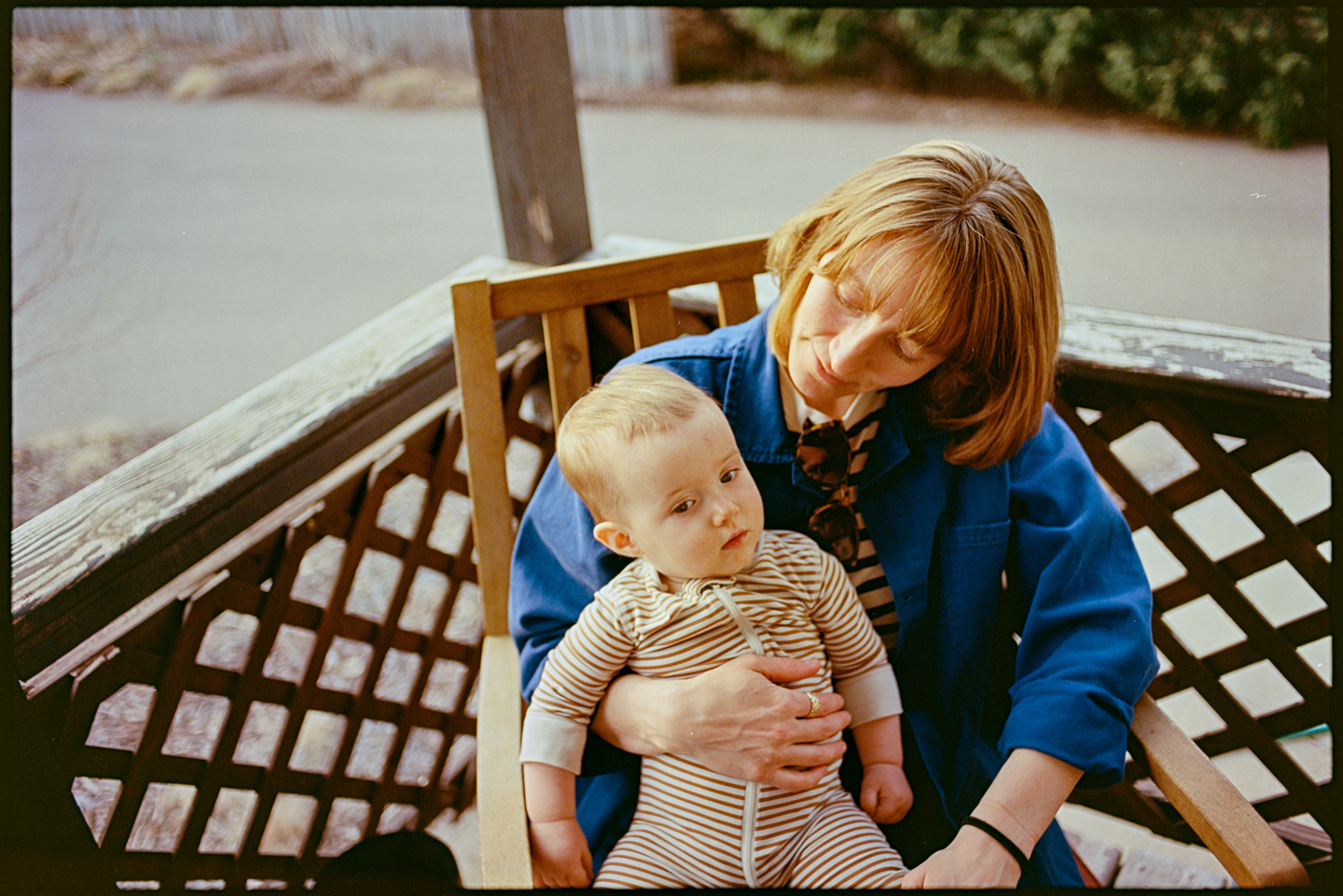 Kallie holding Eileen in her lap at the cookout