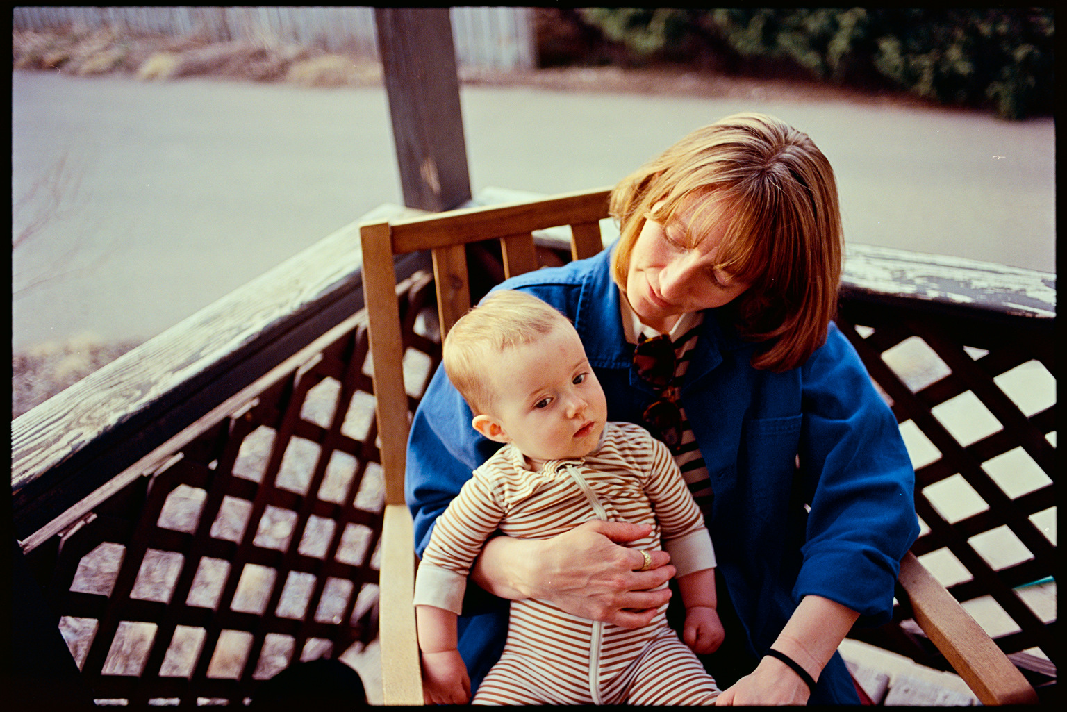 Kallie holding Eileen in her lap at the cookout