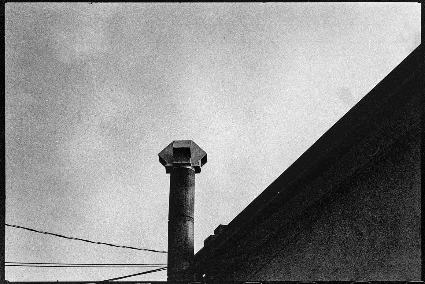 Exhaust pipe coming out of a roof, looks like a periscope