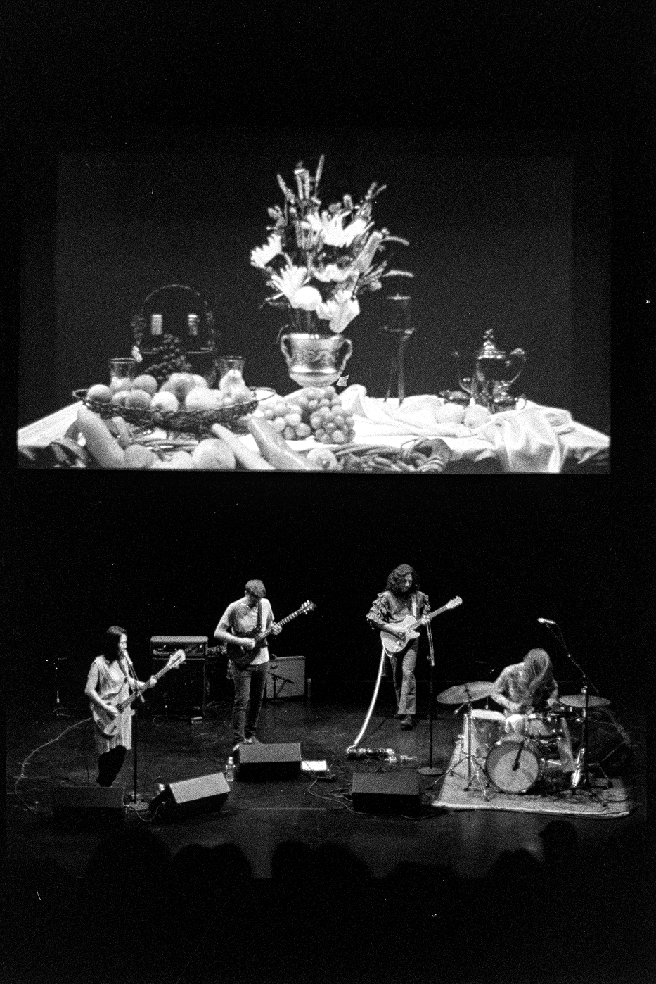 Deerhoof playing live at the Walker Art Center with a film projected above them