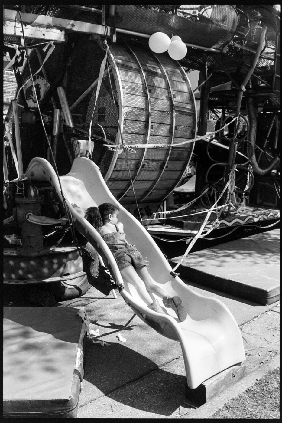 Girl going down a slide on a Mayday Parade float