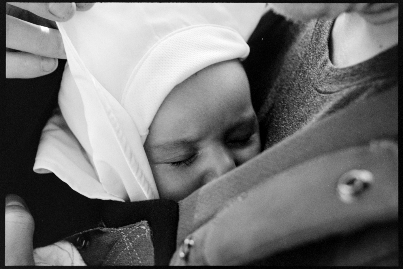 Infant daughter Sloane sleeping against her father Rob's chest