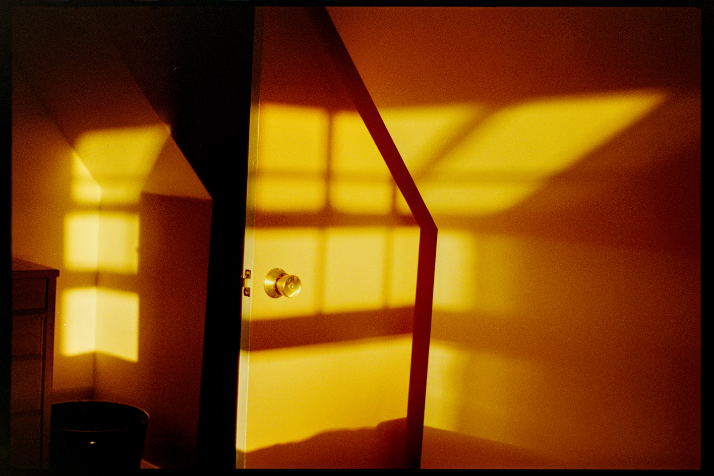 A closet door in a bedroom in the golden evening sunlight