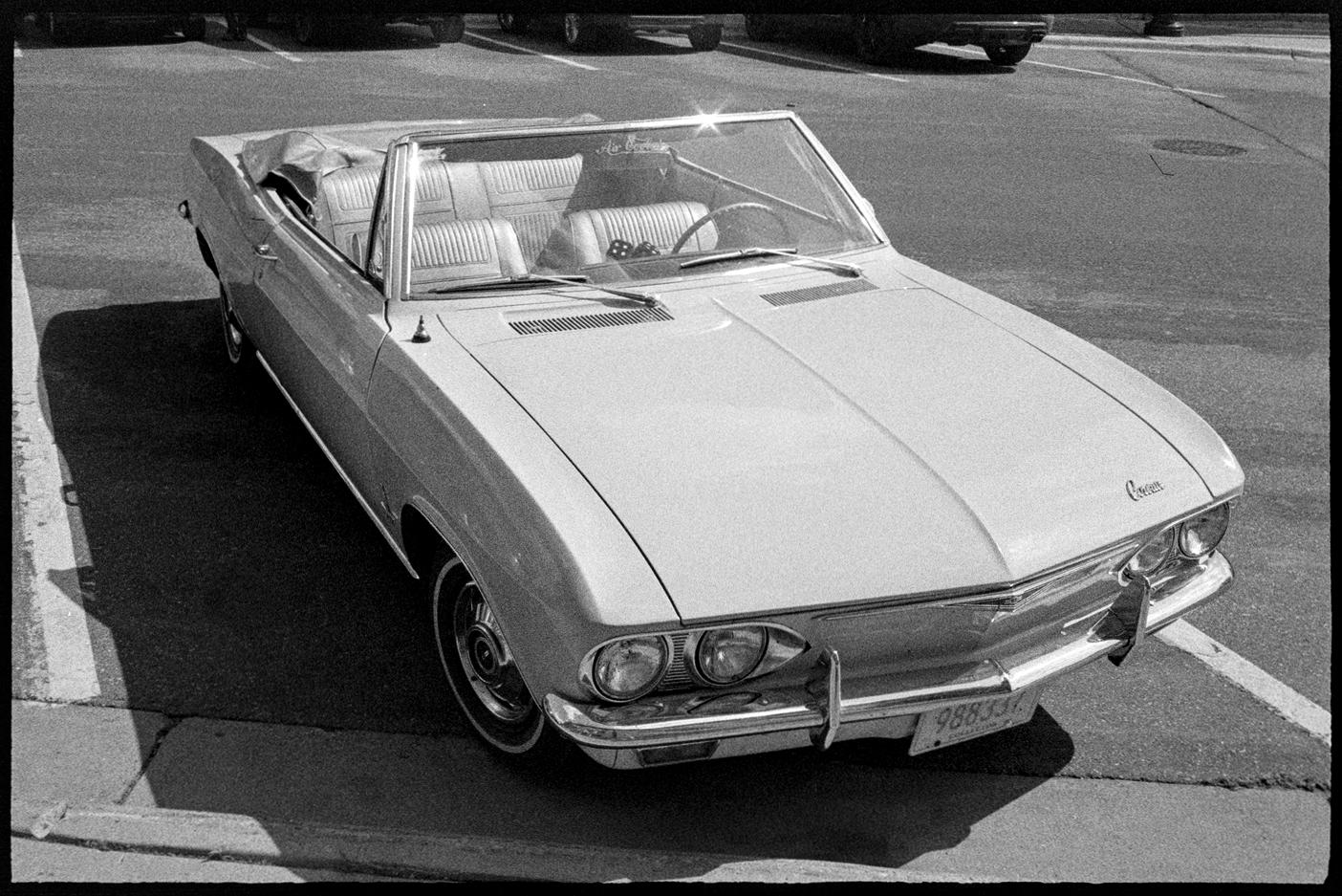 An old classic convertible parked on the street