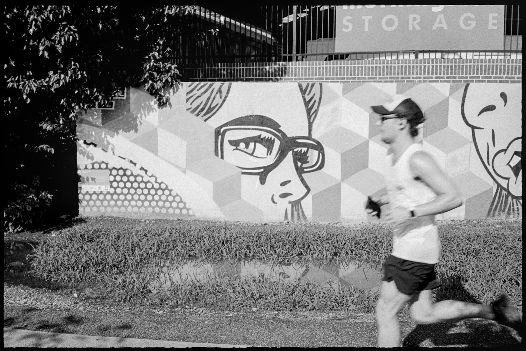 Man jogger past mural on Beltline in Atlanta