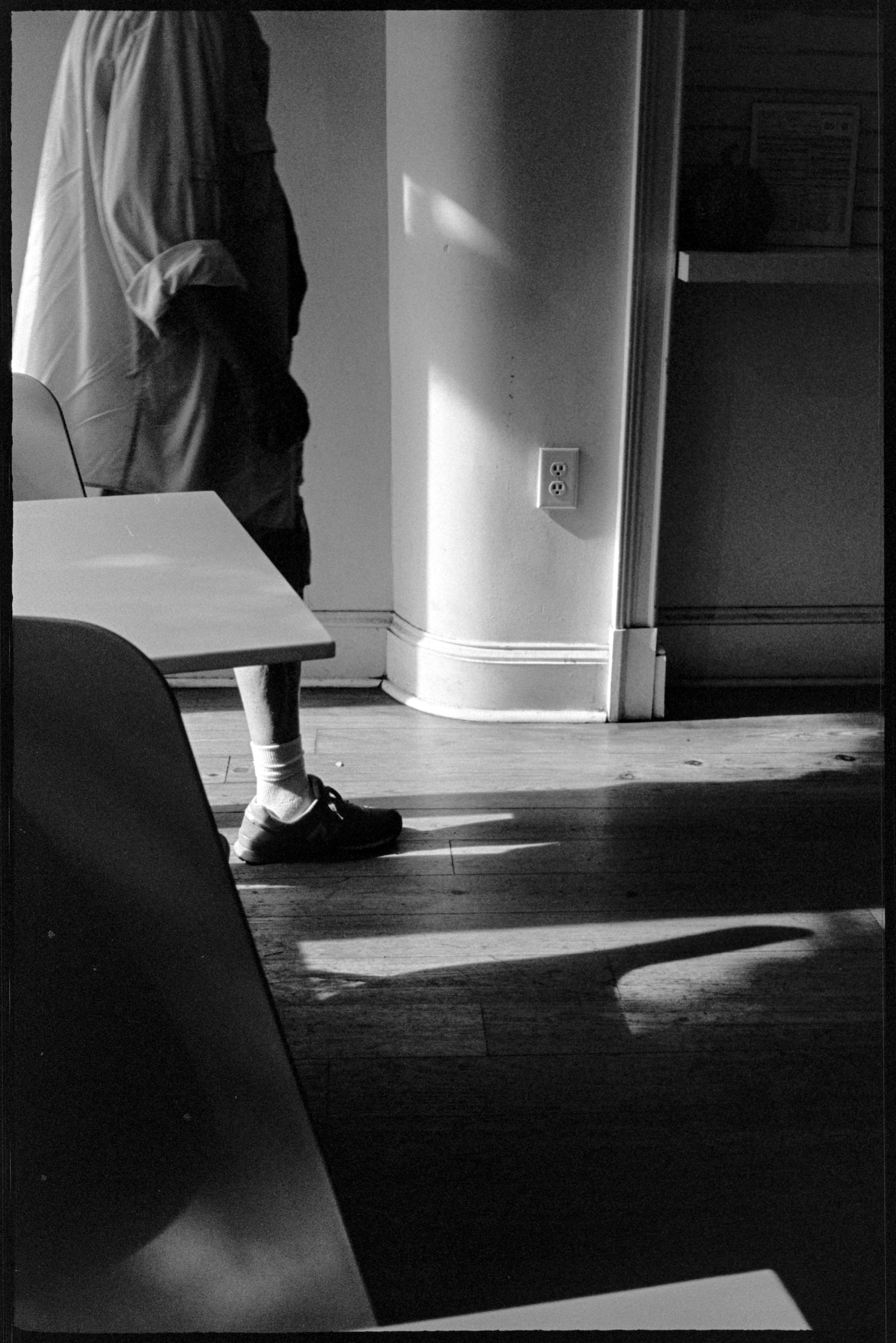 Woman walking into PERC Coffee in morning light in Atlanta