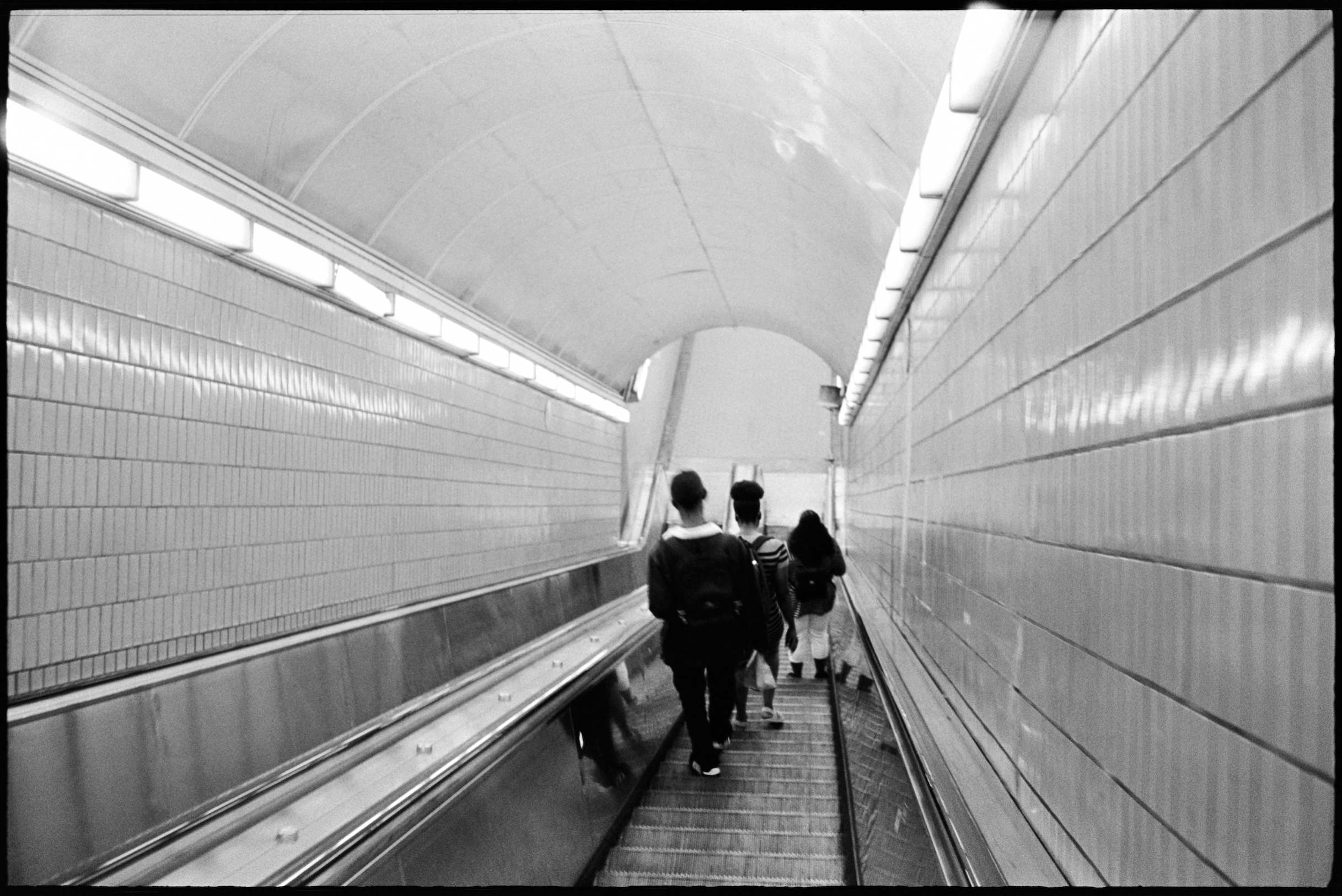 Youths descending into subway on escalator in Atlanta