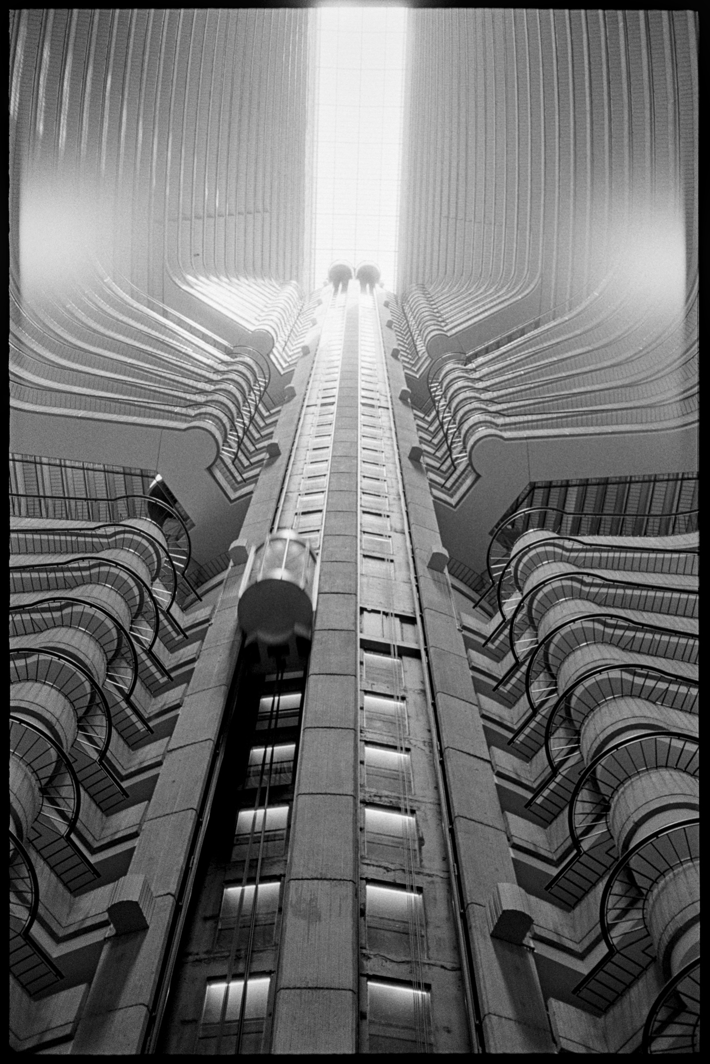 Looking up the elevator shaft inside a brutalist hotel in Atlanta