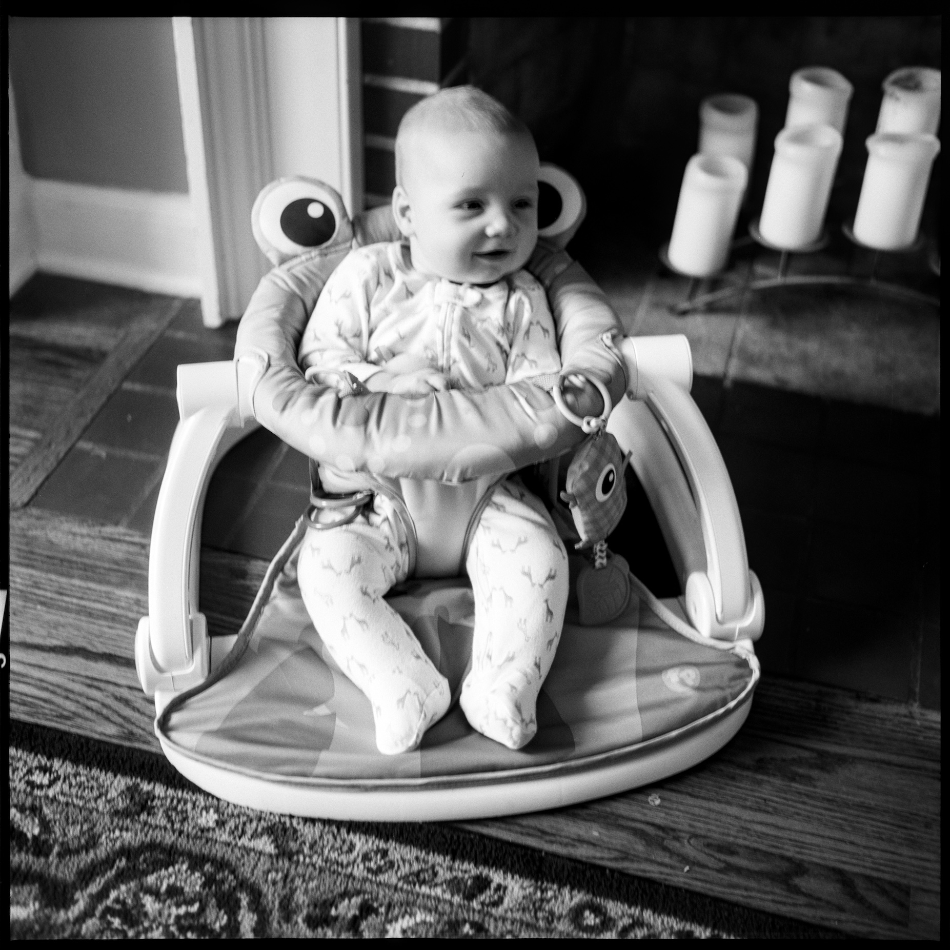 Baby Hughes in a bouncy chair