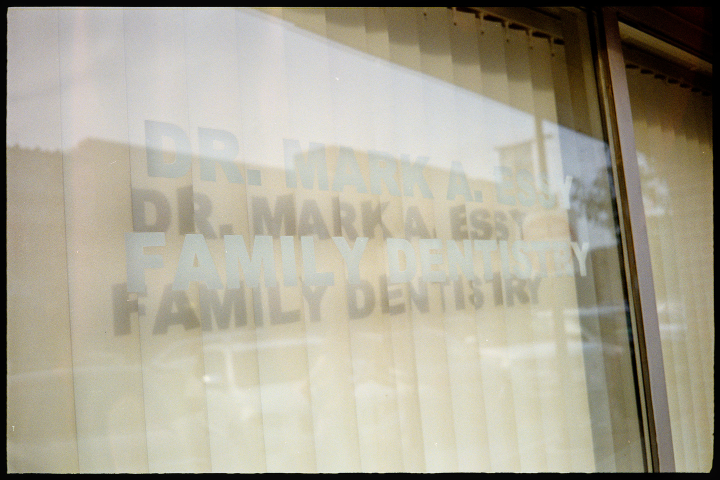 The front window of Dr. Mark A. Essy Family Dentistry in Des Moines