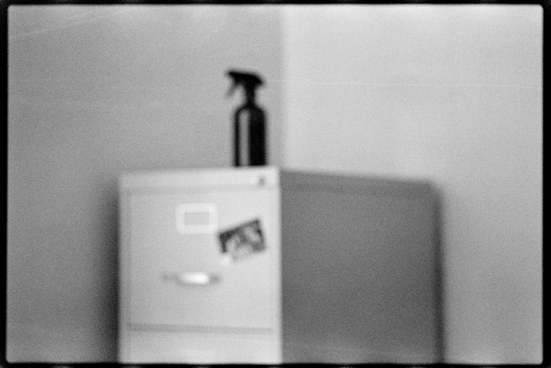 Office filing cabinet with black spray bottle on top