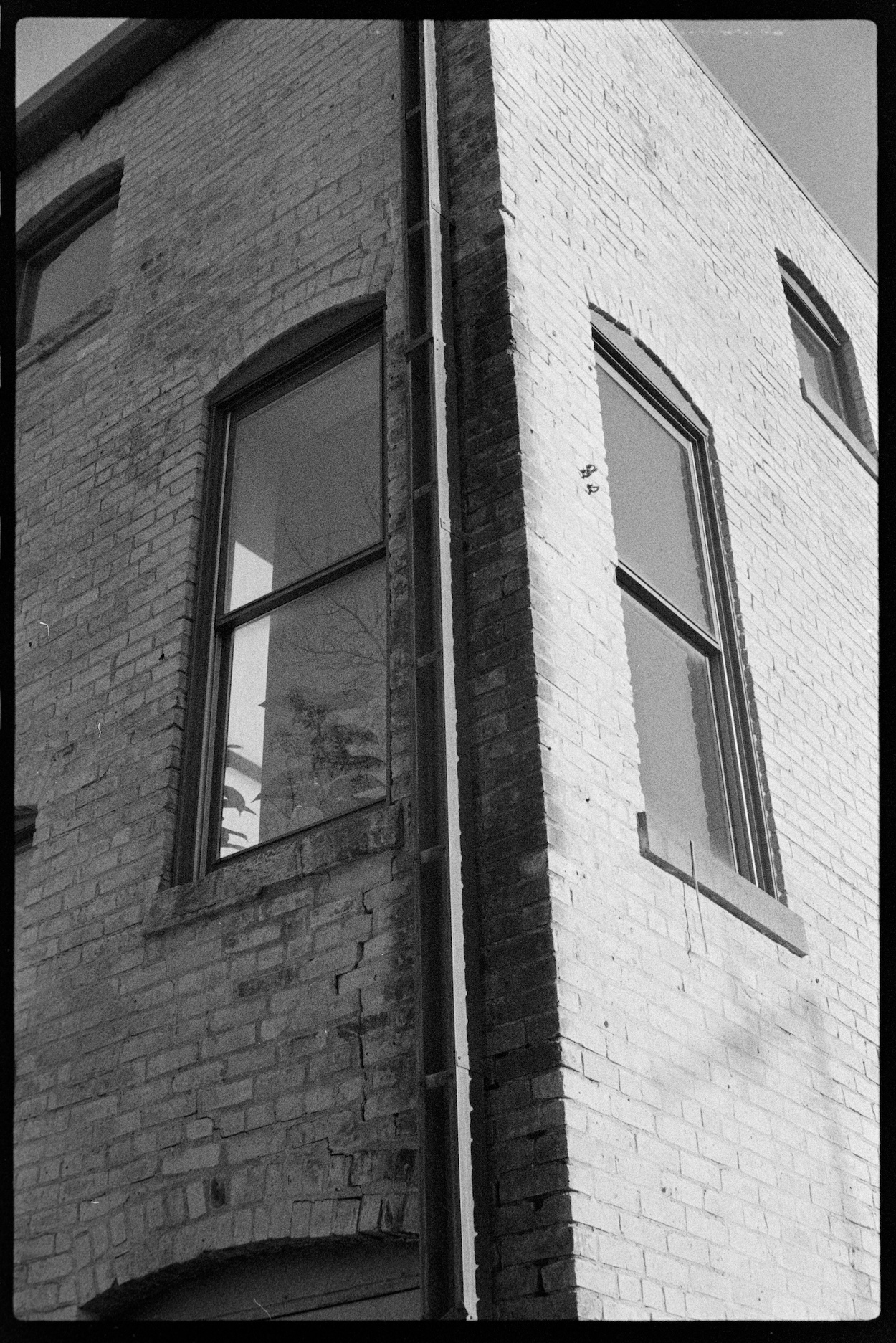 Corner of brick building in setting sun