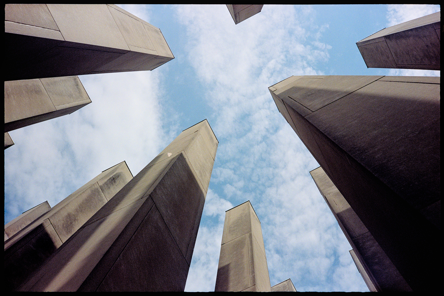 Looking up at the sky from within the war memorial