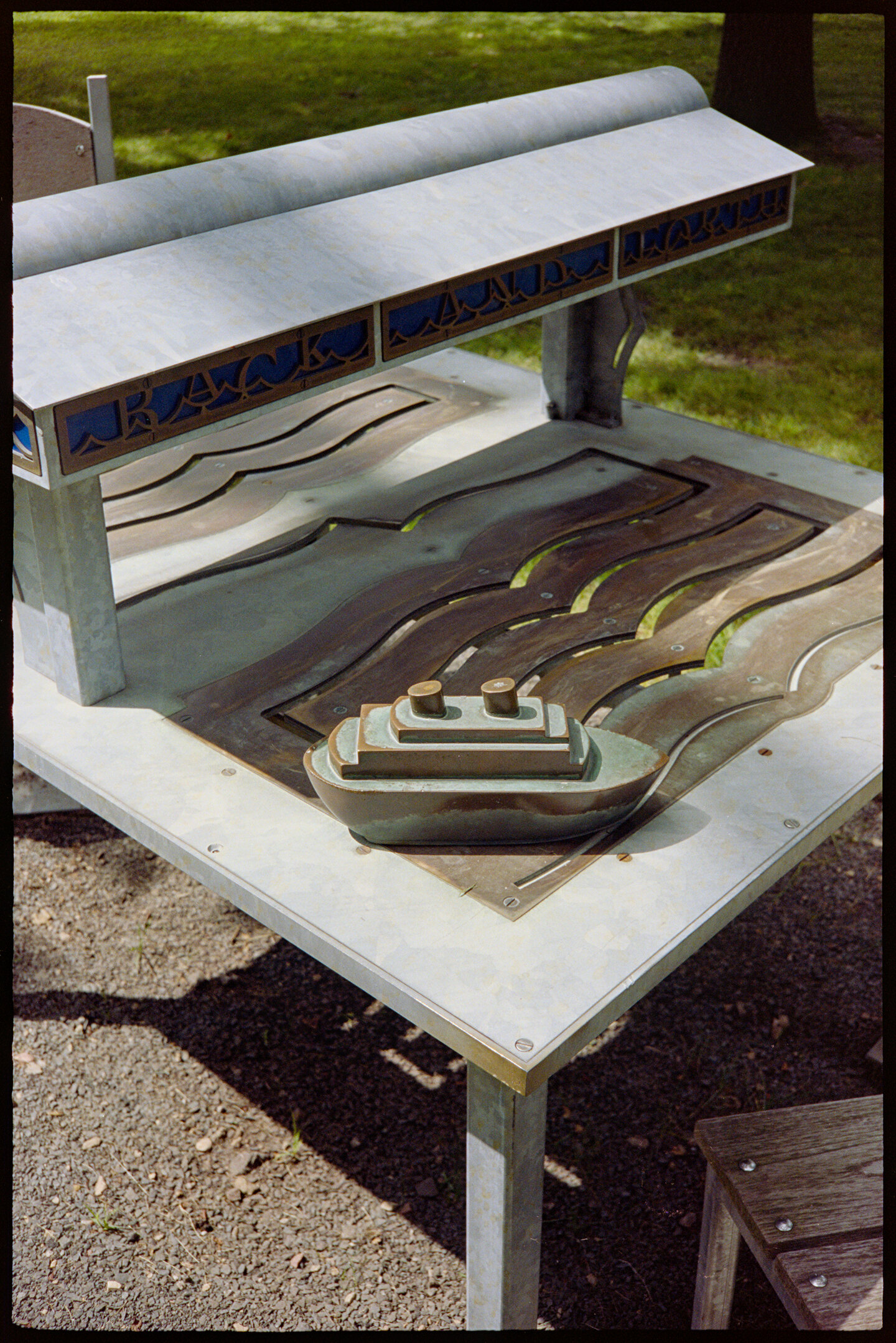 A brass boat mounted a table