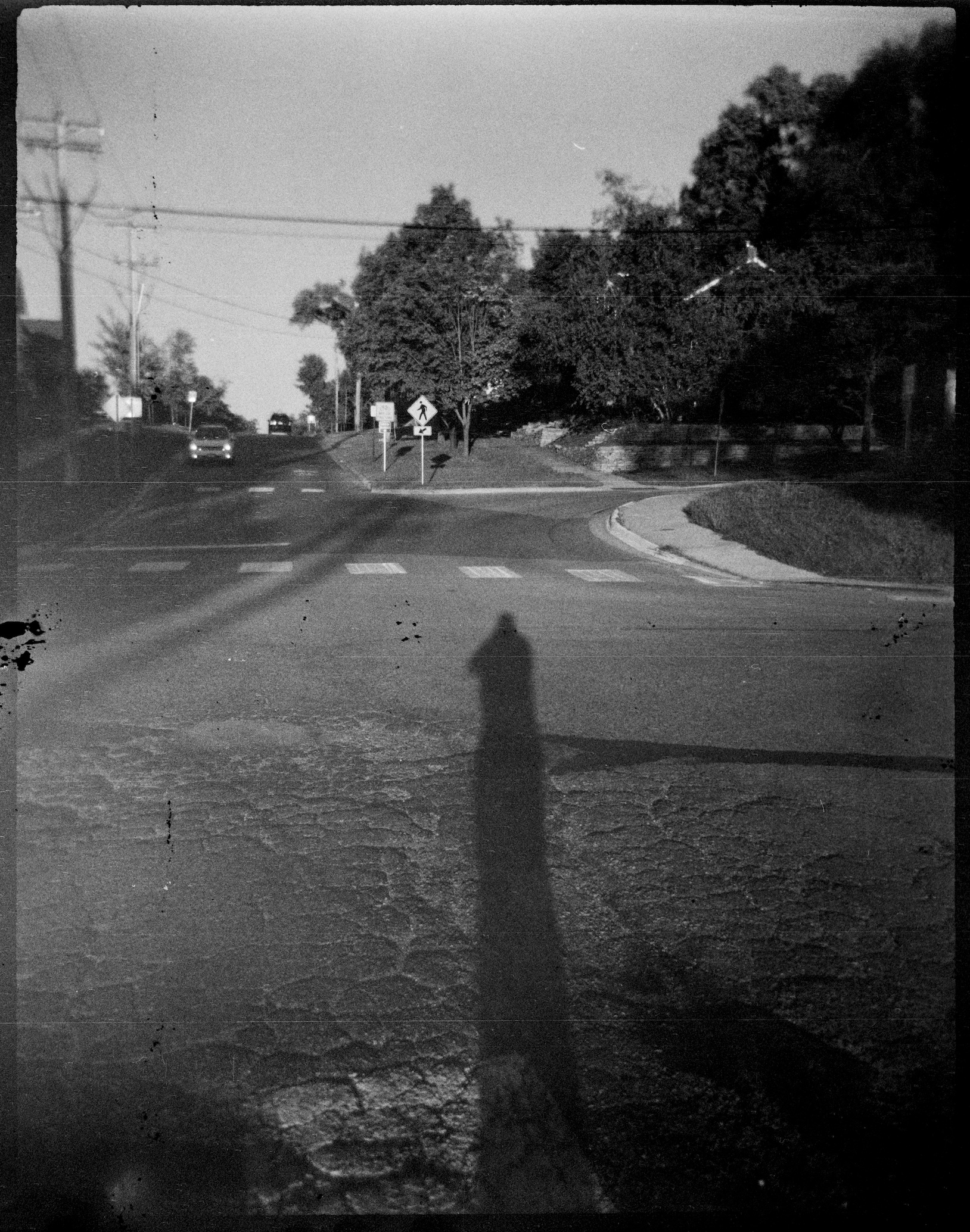 My shadow stretch into the intersection