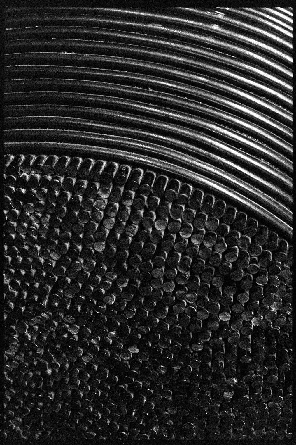 Close up of large sculpture made of dark metal rods