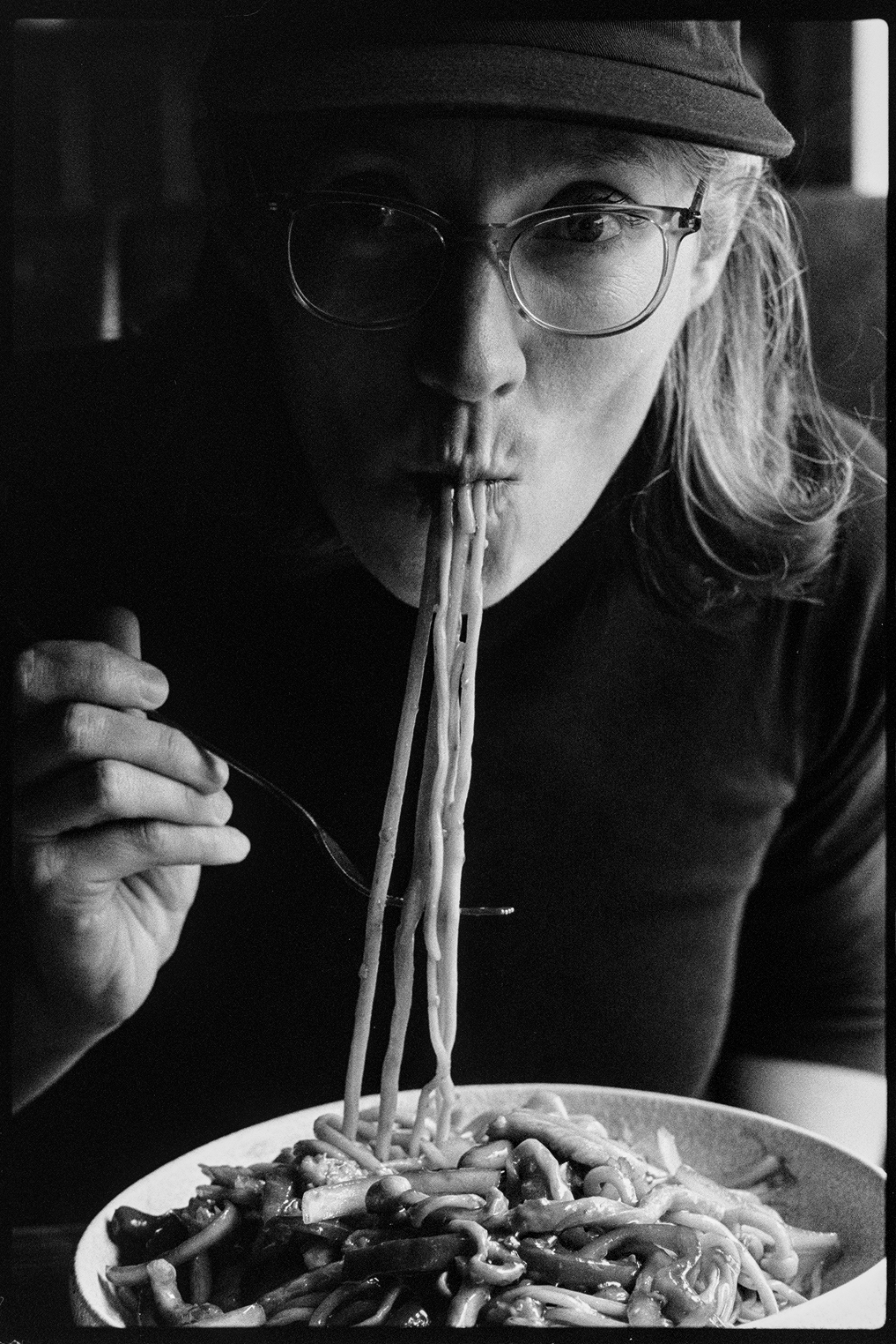 Close up of Kallie eating Chinese pulled noodles