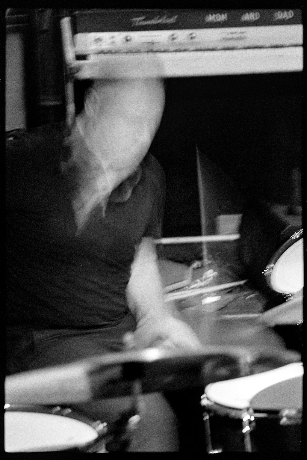 Andrea playing drums with motion blur