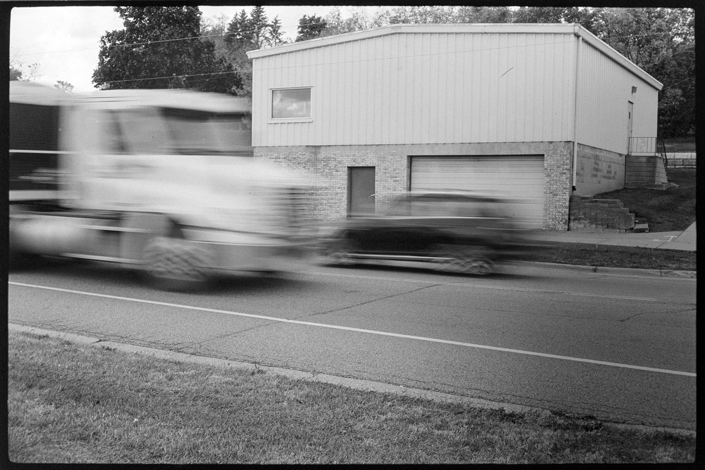 Cars passing each other on a highway with motion blur