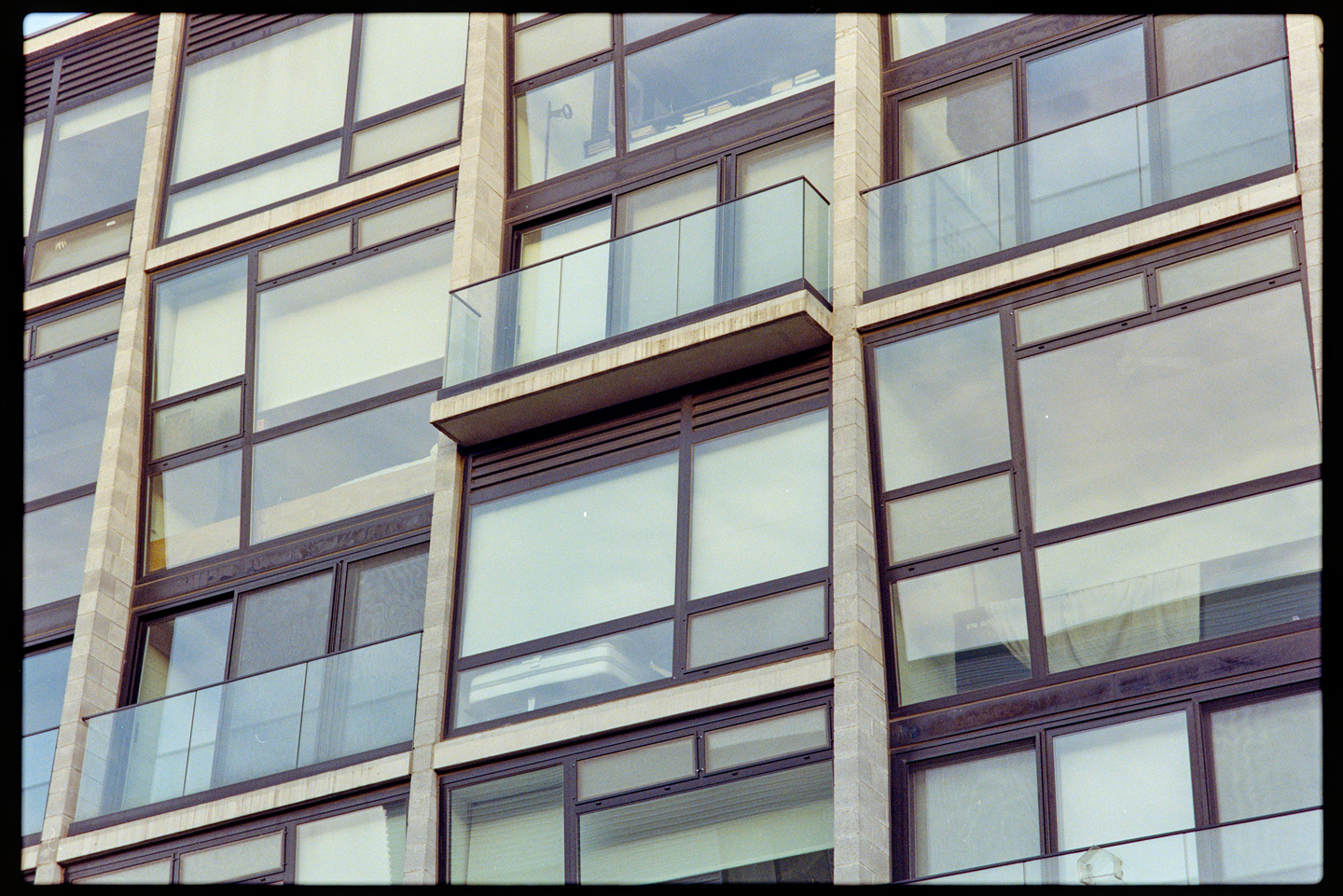 Close up on the windows and balconies of an apartment building