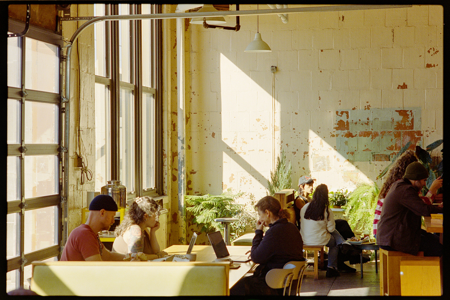 People sitting in the Machine Shop bakery in the Bok building