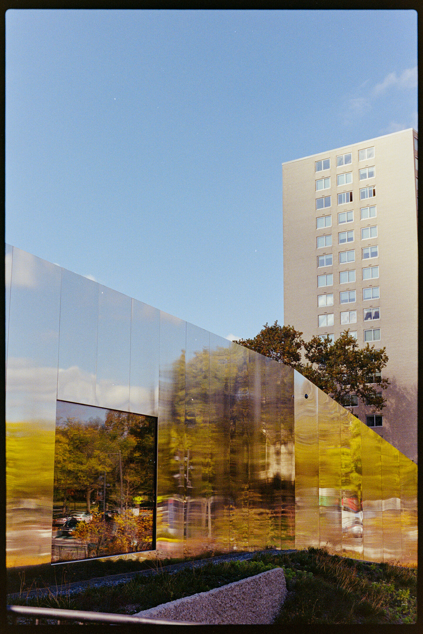 Sky, clouds, and reflections off the walls of Calder Gardens