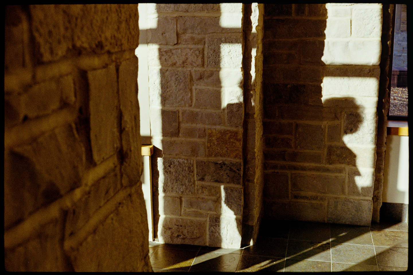 The shadow of a person on the way of a hallway