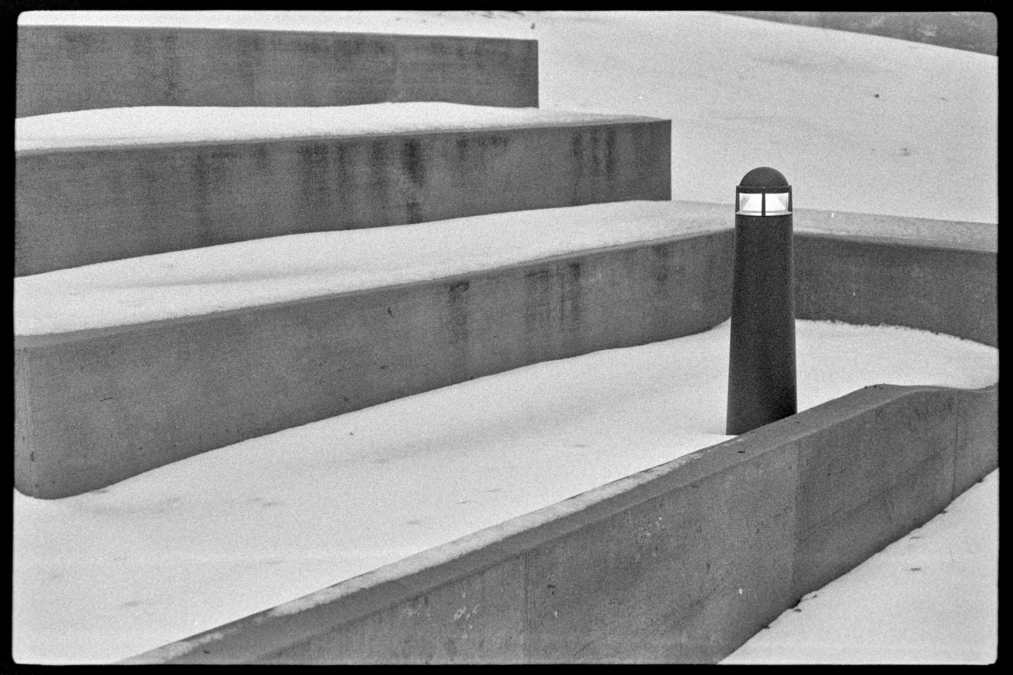 Concrete stairs in snowy hillside at St. Olaf College