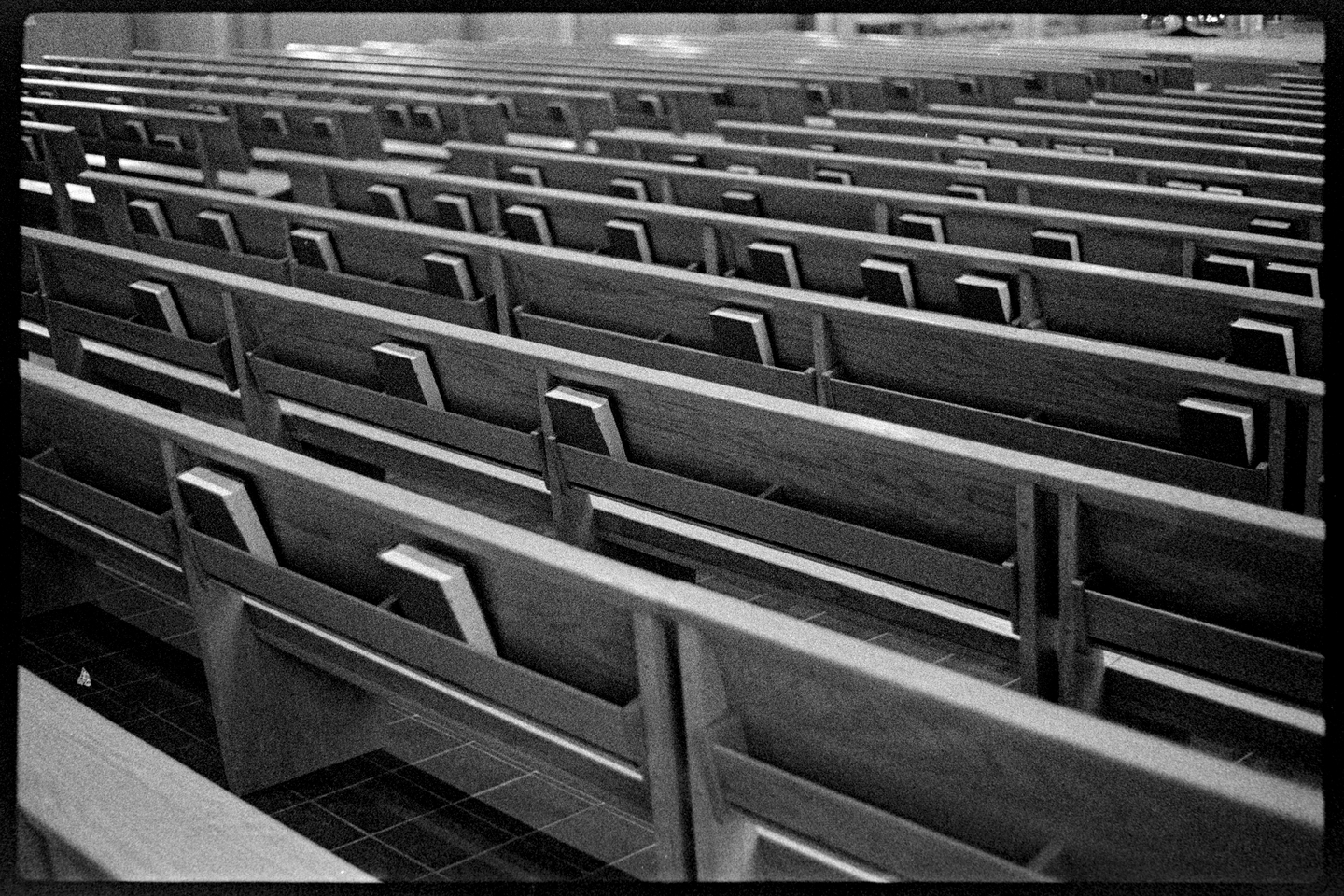 Many rows of pews at the chapel at St. Olaf College