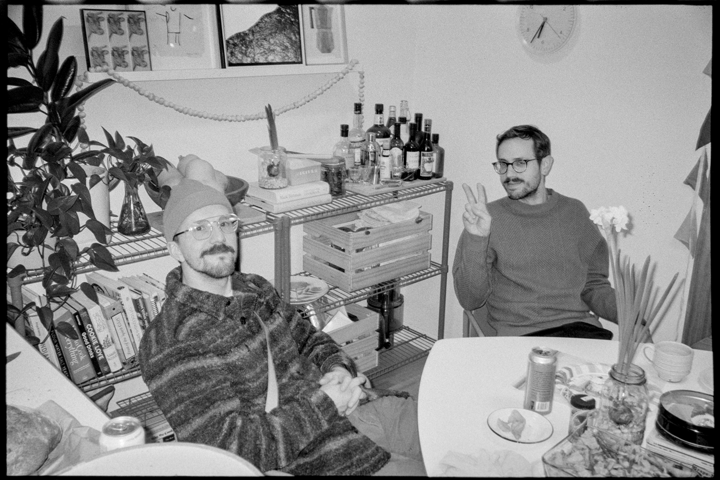 James and Lincoln sitting at the kitchen table during the solstice party