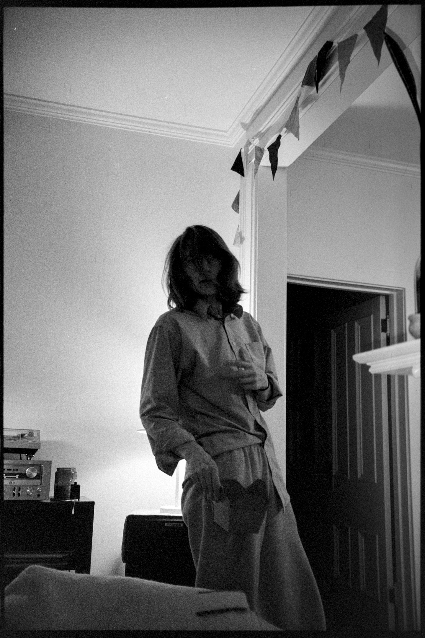 Kallie in pajamas in the living room at night