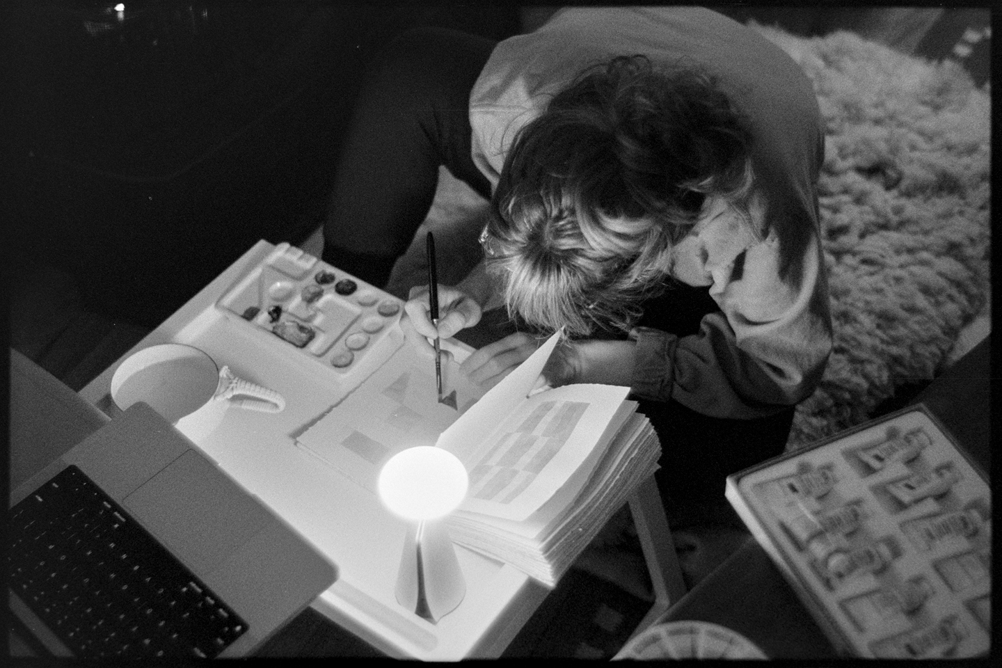Kallie painting in front of the fireplace
