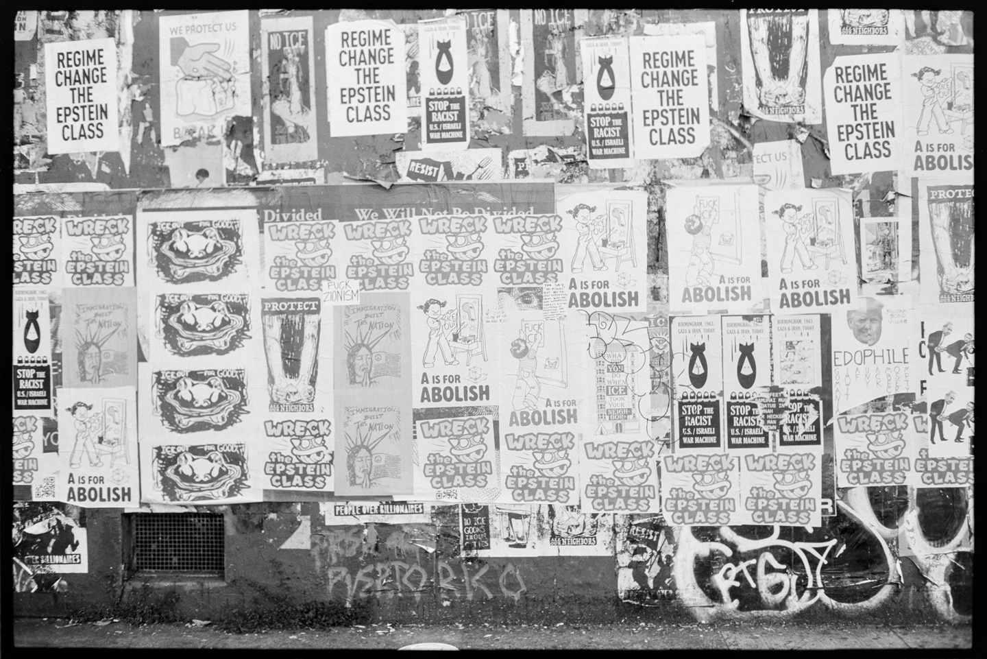 A wall on Valencia Street in San Francisco full of Epstein and anti-ICE posters