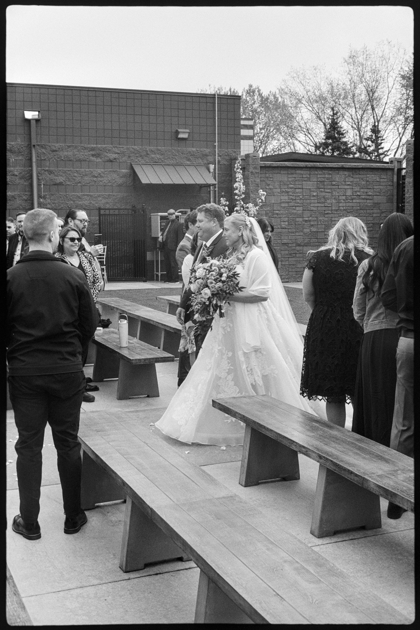 A bride being walked down the aisle by her father