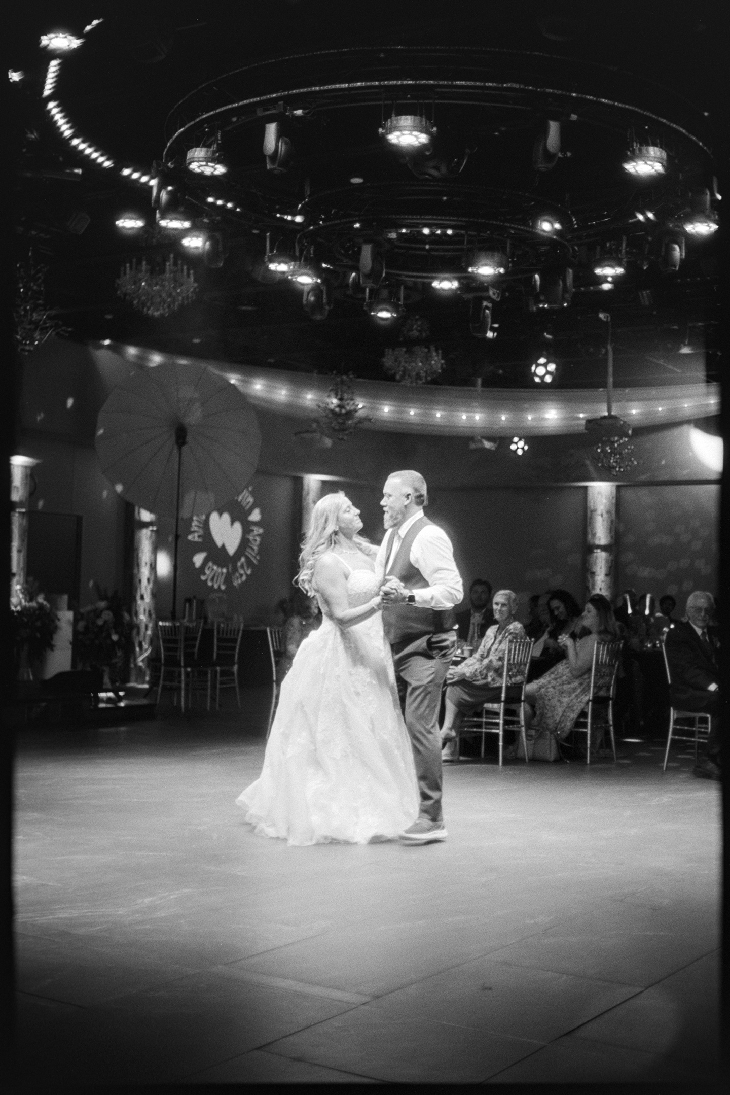 A newlywed couple having their first dance