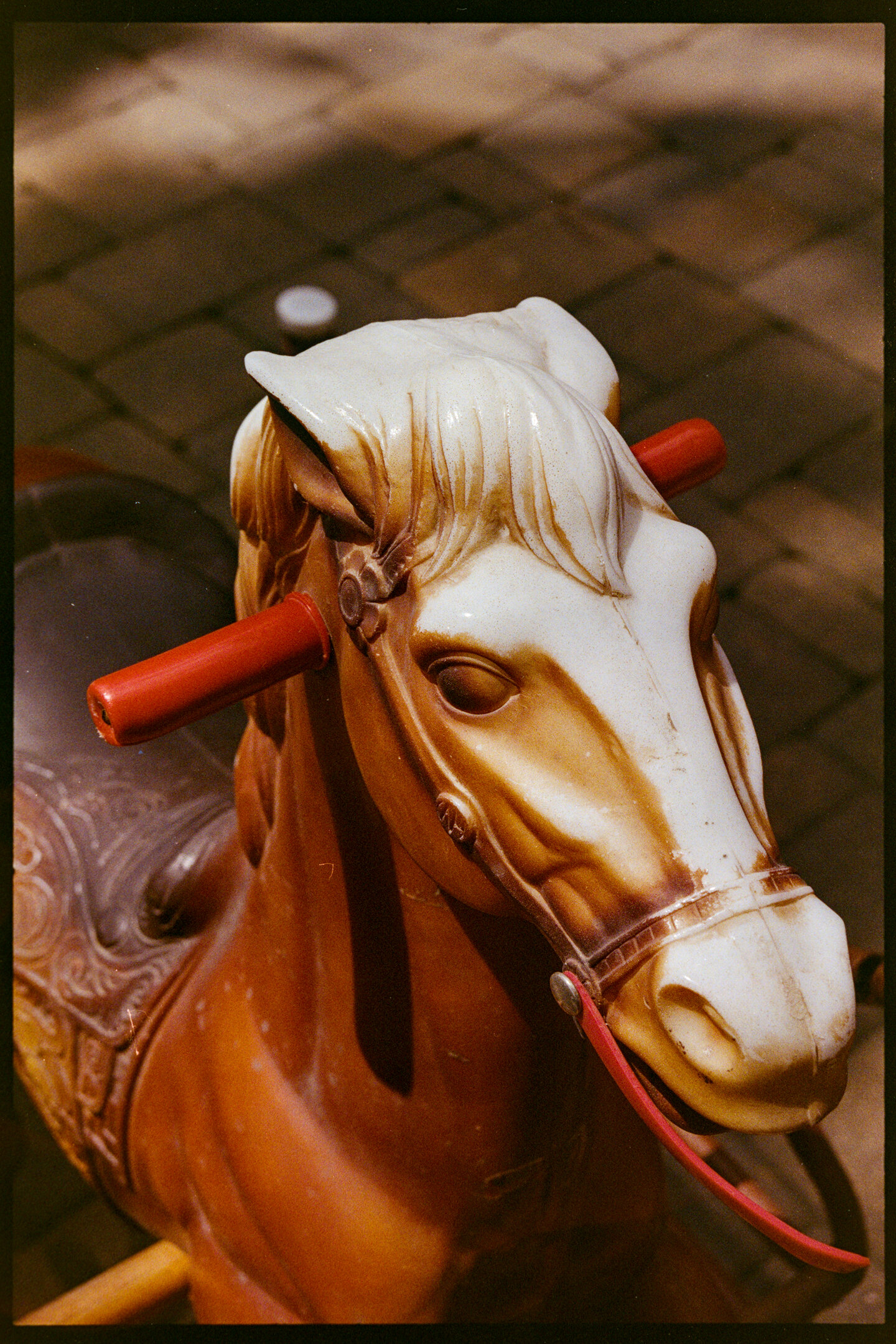 An old plastic horse on springs that can be ridden by kids